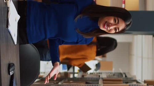 Excited Woman Recording Video in Office Setting