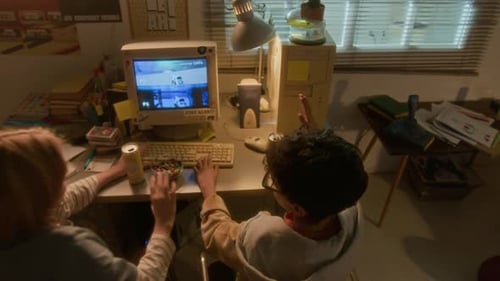 Two Children Play Video Game on Old Computer