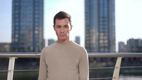 Young Man Poses in Modern Urban Setting