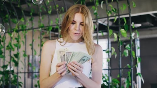 Happy Woman Counting Cash Money Indoors