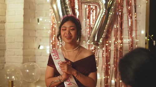 Young Woman Celebrates Birthday with Friends at Home