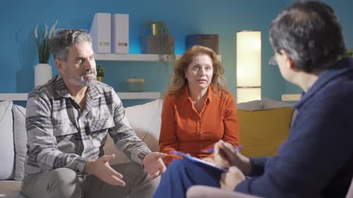 Psychiatrist doctor and troubled couple.