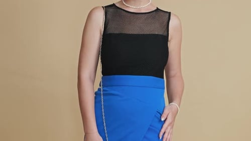 Stylish Woman Posing in Black Top and Blue Skirt