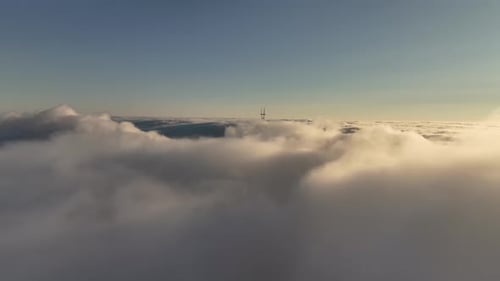 Aerial video above the clouds of San Francisco's Sutero Tower