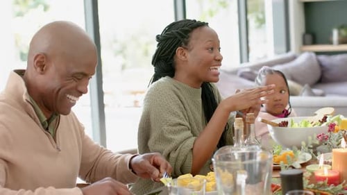 Family Celebrates Together at Dining Table