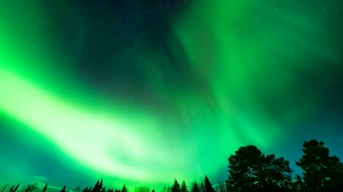 Time lapse of mystical light show as dancing aurora borealis illuminates Norway night sky