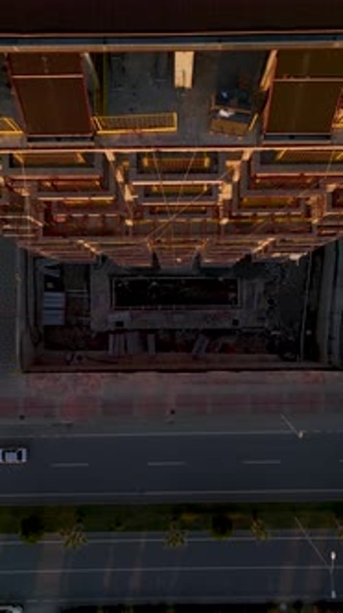 Vertical Video Building Facade Captured Vertically During Construction with Visible Scaffolding and