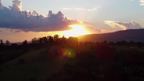 Golden Sunset Over Rolling Rural Hills Landscape