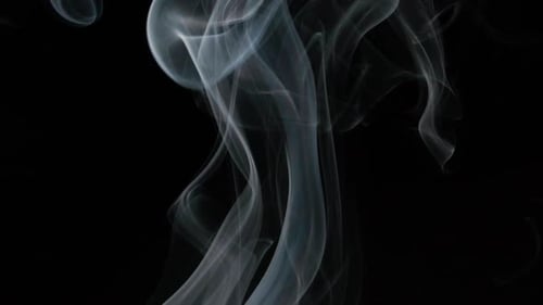 White Smoke Swirling on a Black Background