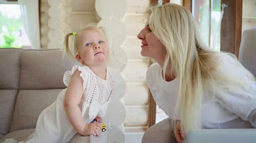 Loving Mother and Child Interact at Home