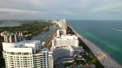 Slow drone dolly shot of Miami Beach, Florida. Fontainebleau hotel and other classic art deco hotels