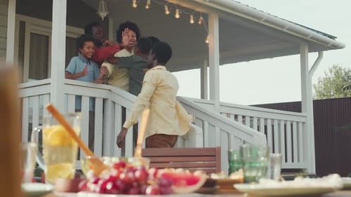 Friends and Family Gather Together on Suburban Porch