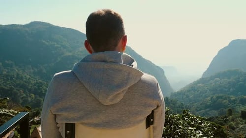 Young Traveller Sitting on Chair Enjoy Mountain Landscape on Sunrise