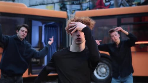 Portrait of Three Cool Guys Dancing Together on City Street Move By Hiphop Music Medium Shot