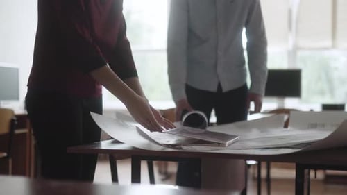 Man and the Woman in the Office Discuss the Project and Make Changes Male and Female Engineers