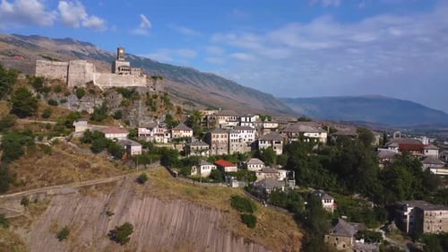 Aerial drone view of the old castle and fortress of the city of Gjirokaster or gjirokastra, Albania.