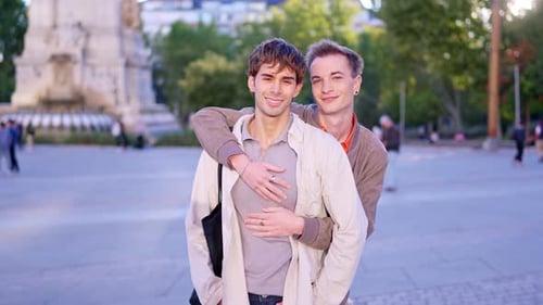 Romantic Gay Couple Hugging and Smiling Outside