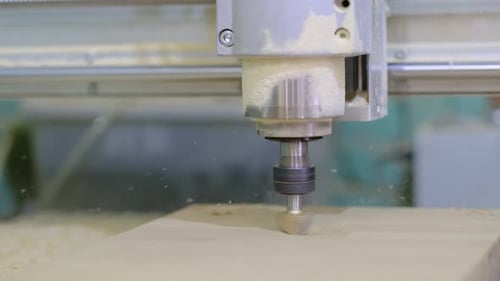Close Up of Wood Milling Machine Drilling Wood