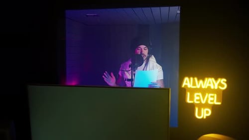 Professional Voice Actor Man is Reading Text and Recording Sound Portrait in Isolation Booth