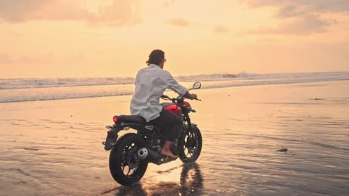 Man Riding Motobike Outdoor or Motorbiker Traveling Summer Beach on Motorcycle