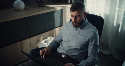 Financial Expert Working on Laptop Monitoring Exchange Market Charts Making Investments