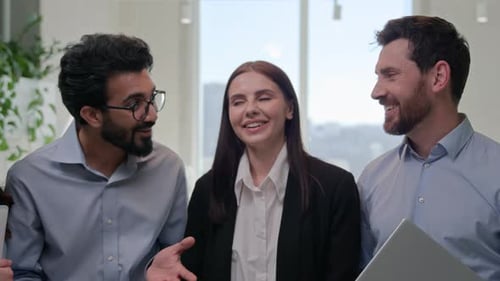 Happy Business Team Smiling in Office Setting