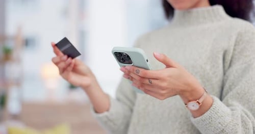 Woman Makes Online Purchase With Phone and Credit Card