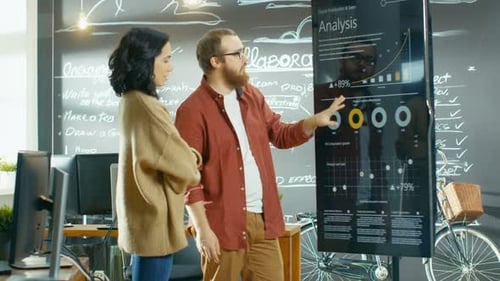 Business Colleagues Discussing Analysis on Digital Screen