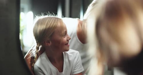 Woman and Child in a Mirror at Home