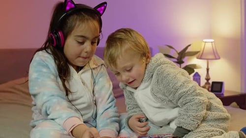 Kids Using Tablet Bedroom For Digital Education Watching Cartoons And Learning