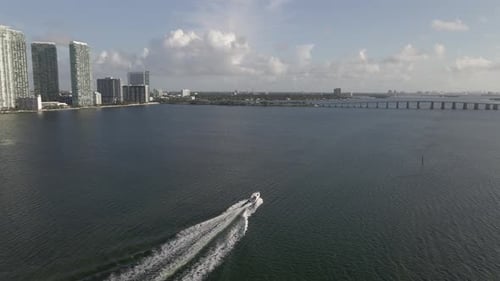 Following aerial as boat motors into Biscayne Bay near Tuttle Causeway