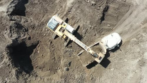 Aerial video of work in the construction area of heavy machinery in motion