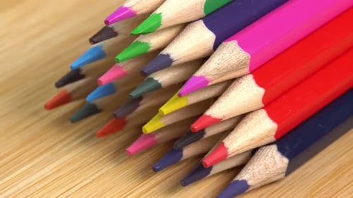 Close up of Multicolored Pencils on Wooden Surface