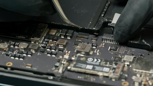 Technician or engineer repairs or replaces new parts of broken and damaged laptop and tablet