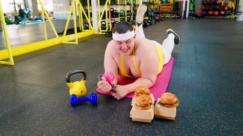 Fat Sportsman Burger In Gym Dumbbell