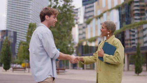 Diverse Business People Handshake Agreement Meeting Outdoors