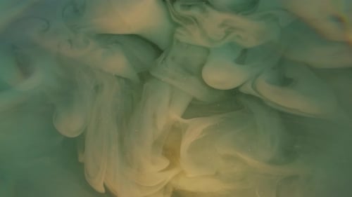 Colorful Abstract Ink Swirls in Water Background