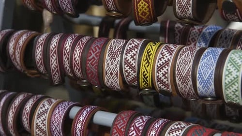 leather bracelets with colorful folk patterns at the craft market