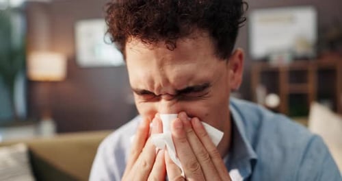 Man Using Tissue at Home Close Up
