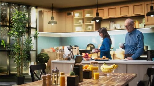 Couple in Kitchen Talking and Having Breakfast