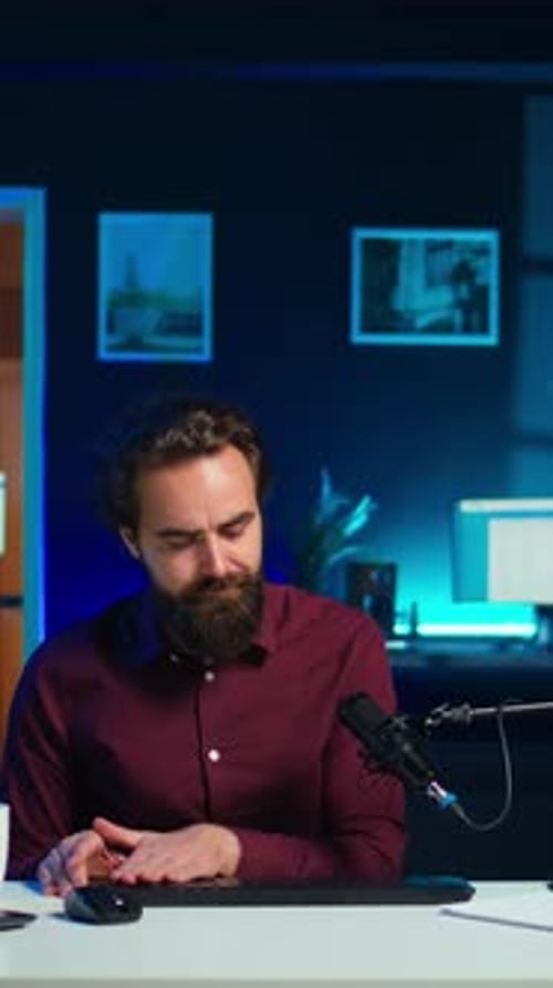 Vertical Video Man Filming Video for Online Channel Presenting Mouse and Keyboard