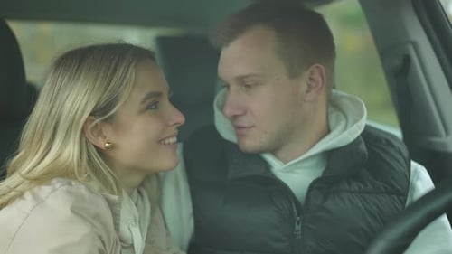 Smiling Couple Chatting in the Car