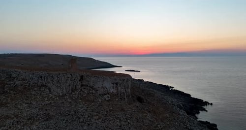 Drone hyperlapse video with a dramatic boom-down camera movement, showcasing an ancient tower perche