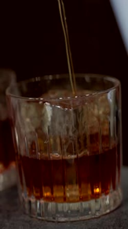 Pouring liquor into an iced glass
