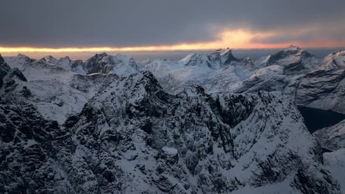 A Cinematic View Captures the Vastness of the Nordic Winter Showcasing a Snowy Mountain Range From