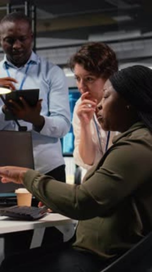 Vertical Video Engineering Team in Office Using AI to Optimize Company Systems