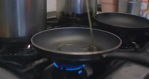 Olive Oil Poured into a Frying Pan