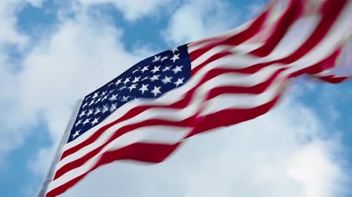 American Flag Waving Against a Blue Sky