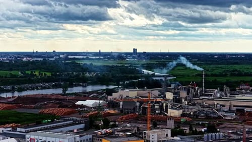Industrial area smokestack industry heavy manufacturing factory buildings chimney smoke steam