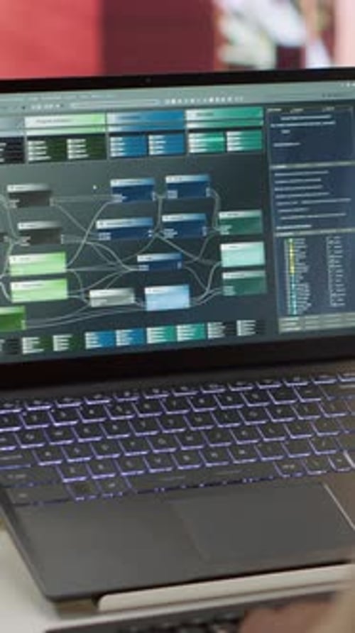 Vertical Video Professional Software Developer at Desk Working on AI Coding